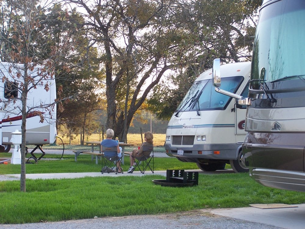 Couple sitting in lawn chairs at Mill Creek RV park
