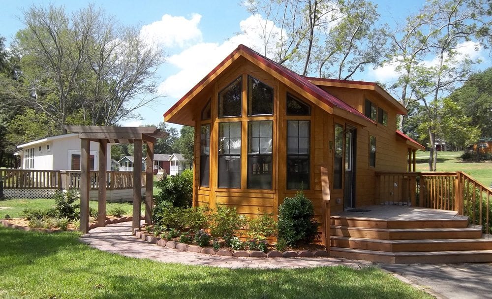 Cabin exterior with porch at Mill Creek Ranch Resort in Canton, TX