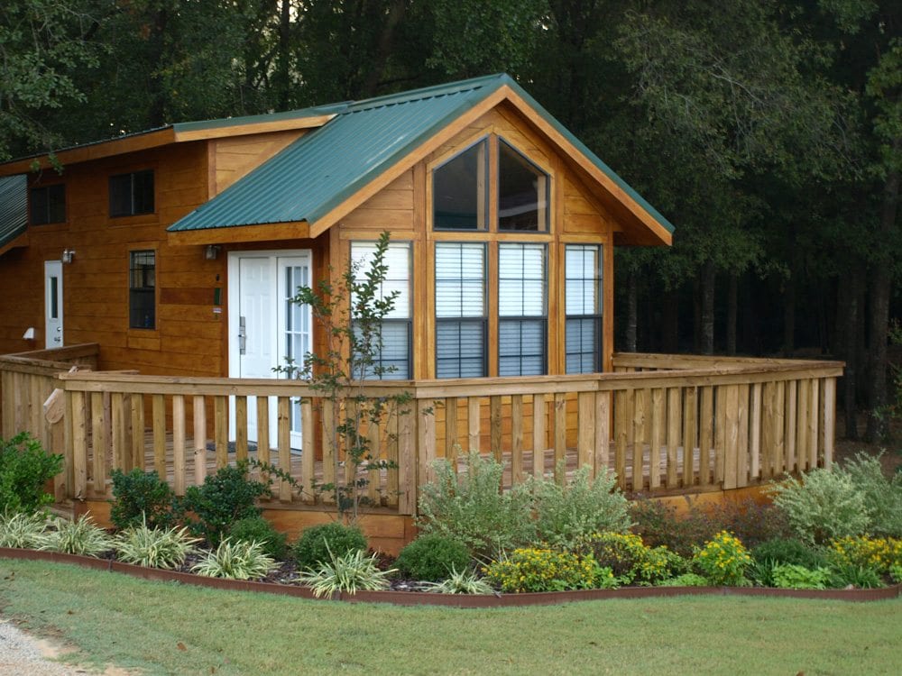 Cabin exterior with wraparound porch at Mill Creek Ranch Resort