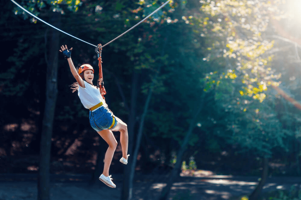 Photo of a Woman Ziplining in East Texas.