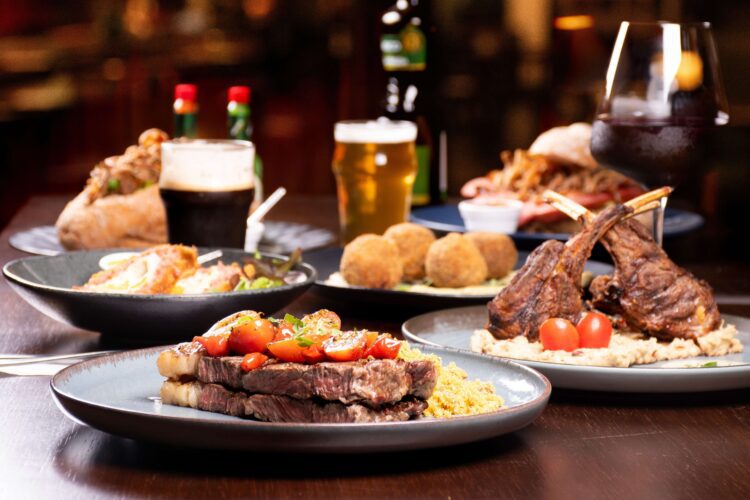 A table with food at the Best Steakhouse in Texas.